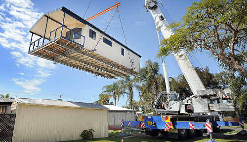 Three cabins were lifted into place at The Happy Wanderer Village Caravan Park in Torquay yesterday. Three cabins were lifted into place at The Happy Wanderer Village Caravan Park in Torquay yesterday.